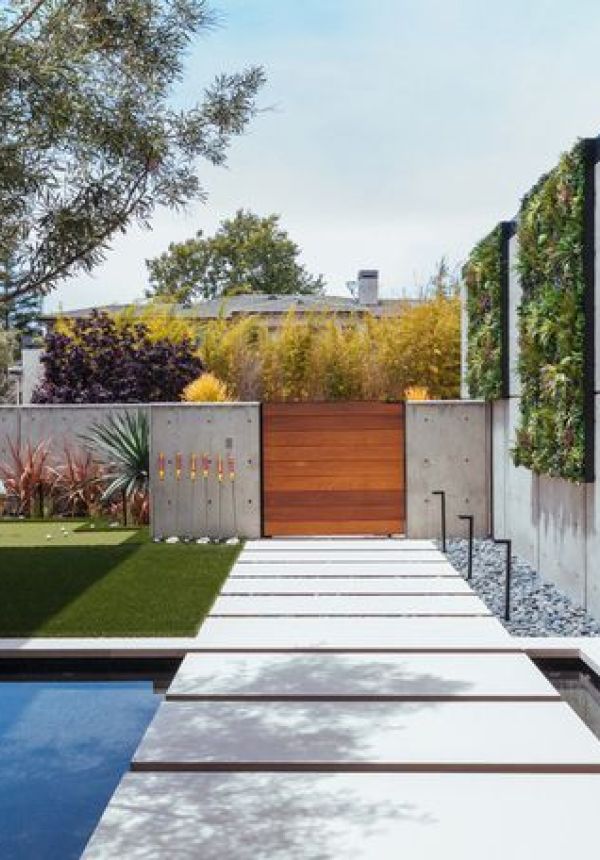 Modern Outdoor Garden with Artificial Green Wall by pool