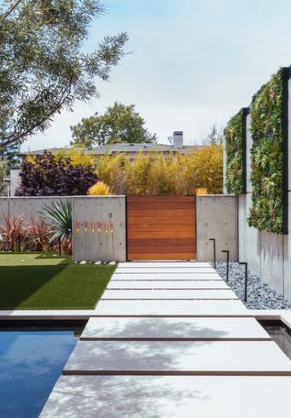 Modern Outdoor Garden with Artificial Green Wall by pool