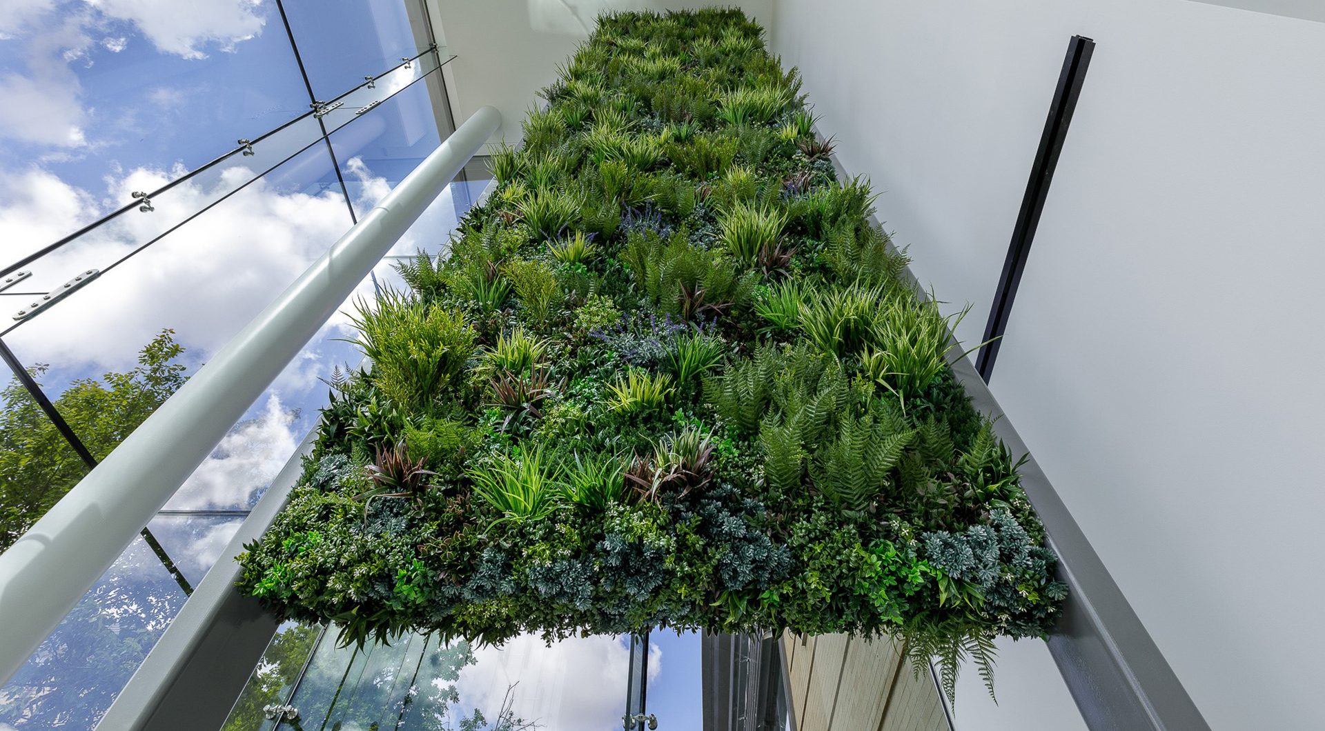 Focal wall design with Vertical Artificial Green Wall at office entrance
